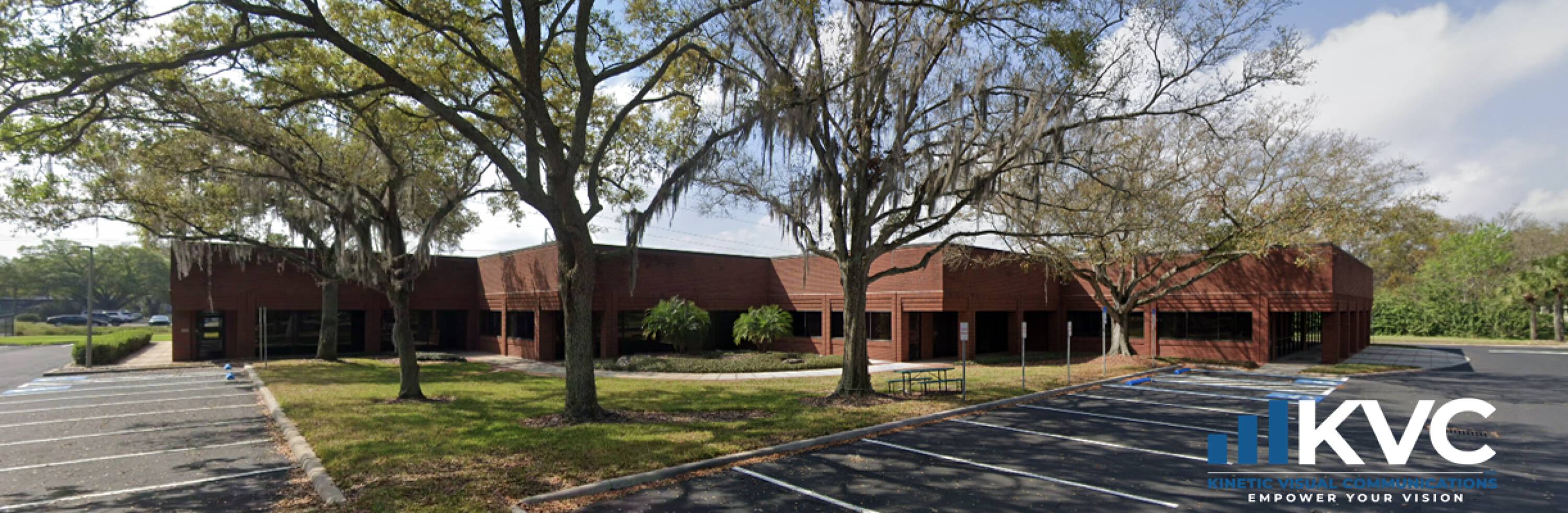 A building with trees in the background

AI-generated content may be incorrect.